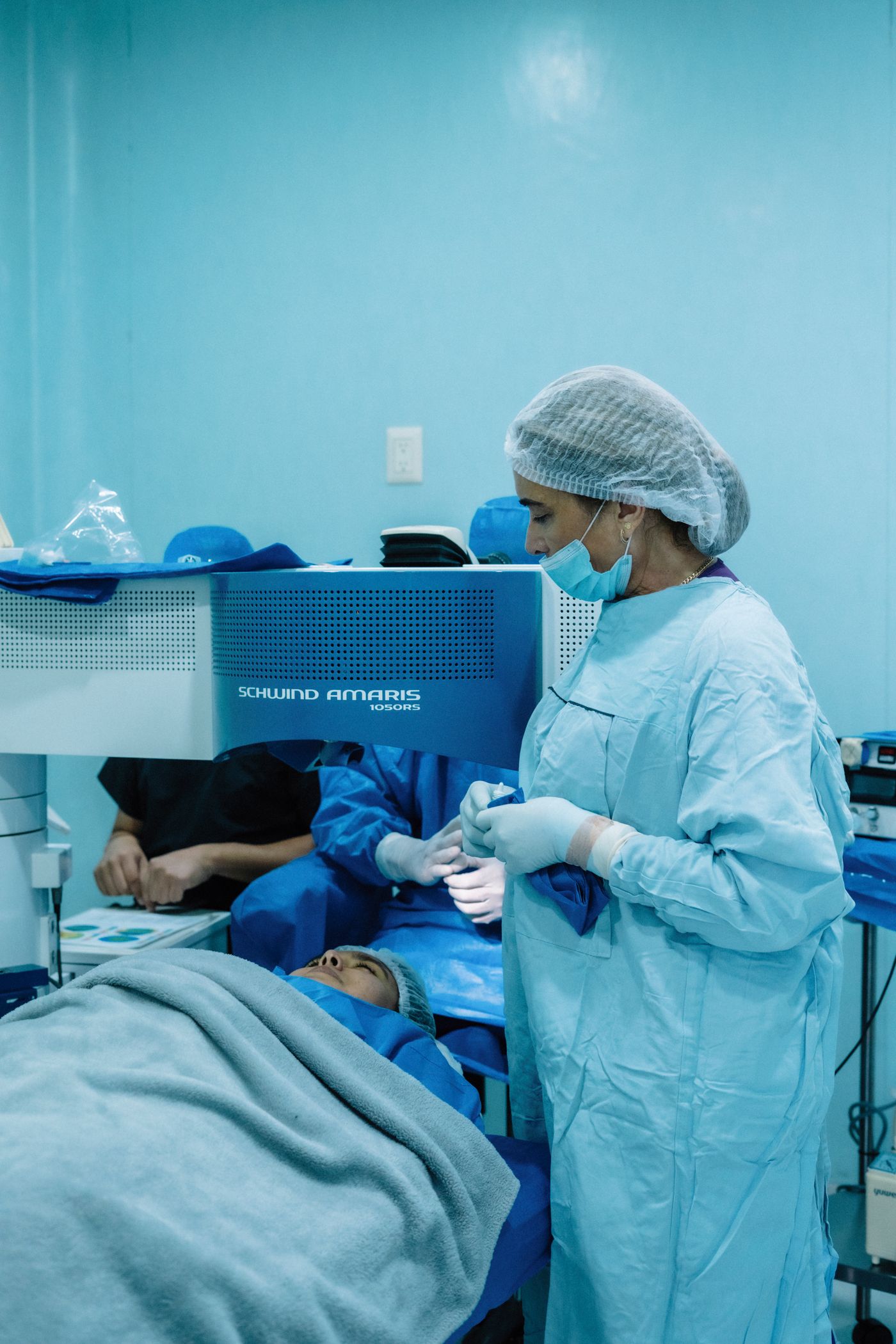 Surgeon preparing a patient for excimer laser eye surgery
