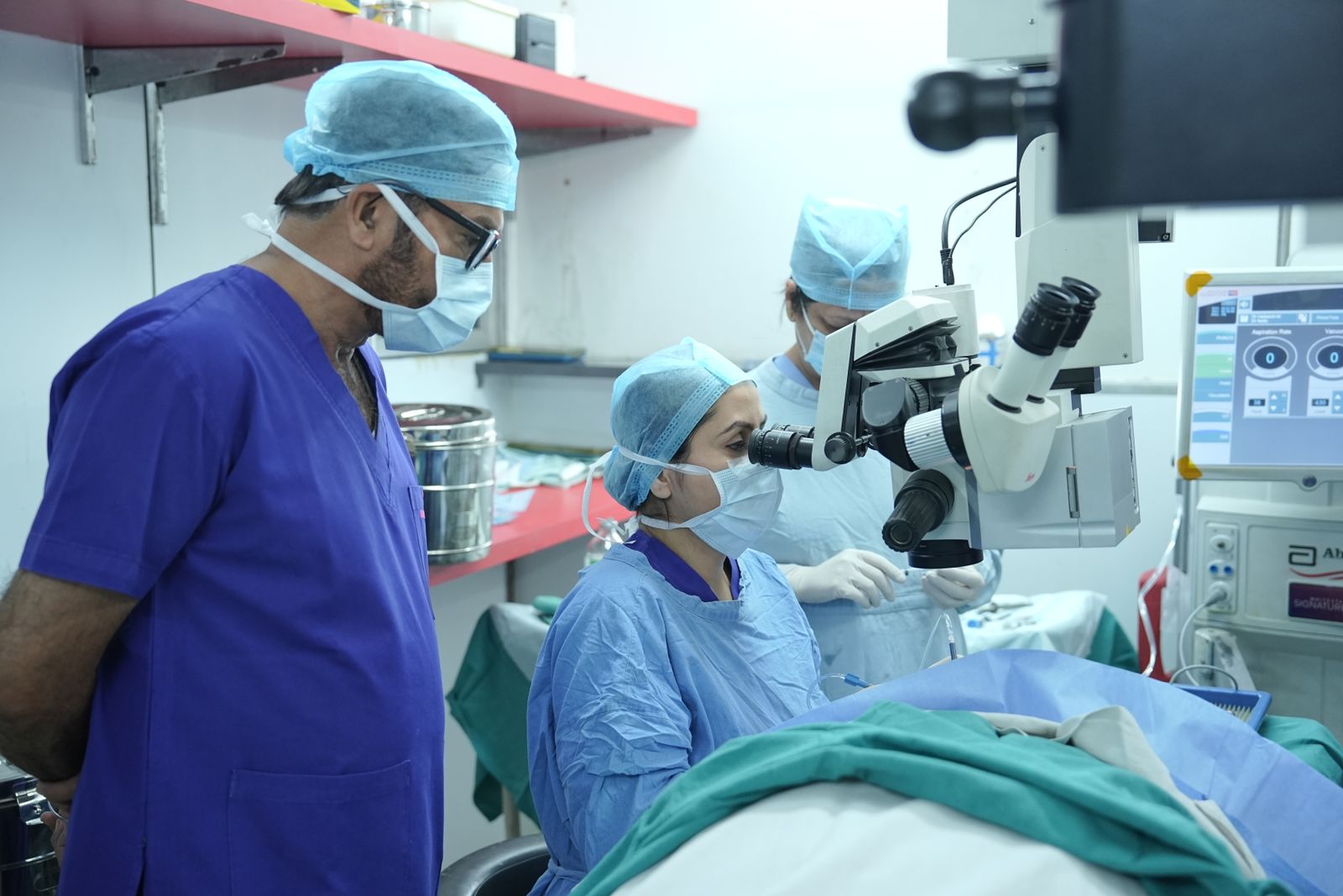 Ophthalmic surgeon performing cataract surgery under an operating microscope